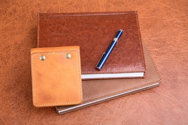 Leather organizers and fountain pen clipart