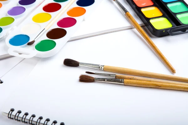 Water colour paints brush albums for drawing on a table — Stock Photo, Image
