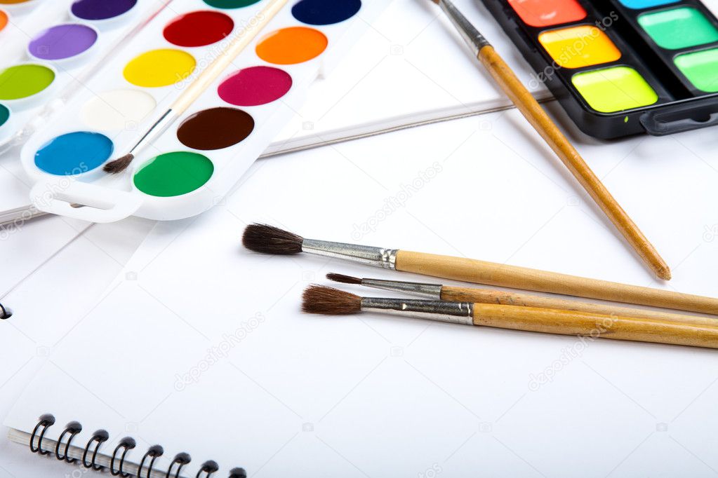Water colour paints brush albums for drawing on a table