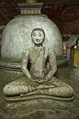 Ancient Buddha image in Dambulla Rock Temple caves, Sri Lanka clipart