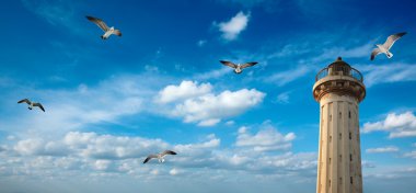 Old lighthouse in the sky with seagulls clipart