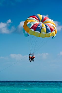 Parasailing in beach clipart