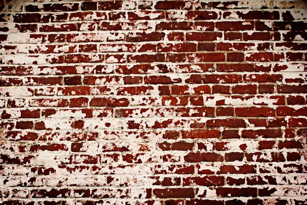 Vecchio muro di mattoni con resti di intonaco — Foto Stock