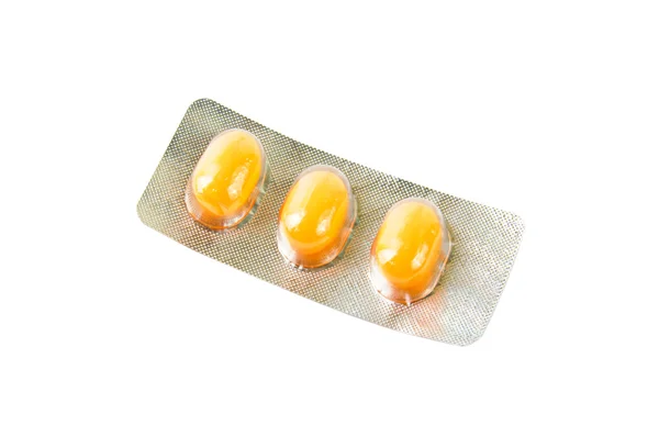 Paket mit orangen Tabletten — Stockfoto
