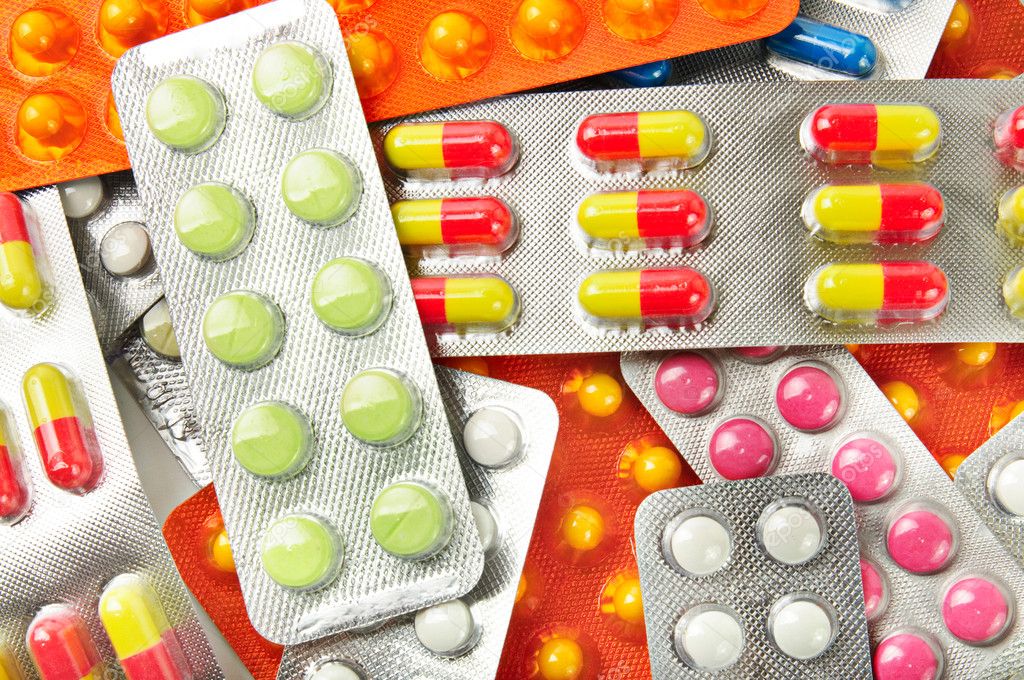 Multicolored medicine pills background