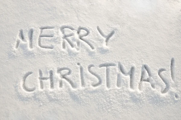 Merry christmas text on snow — Stock Photo, Image