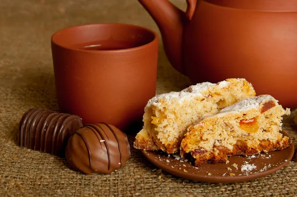 stock image Clay teapot with sweets