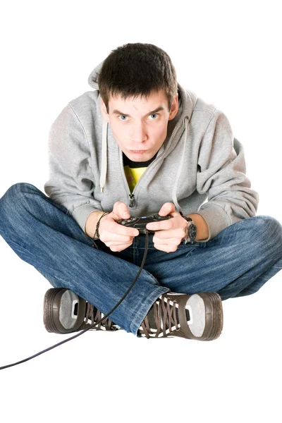 Νεαρός άνδρας με ένα joystick για κονσόλα παιχνιδιών — ストック写真