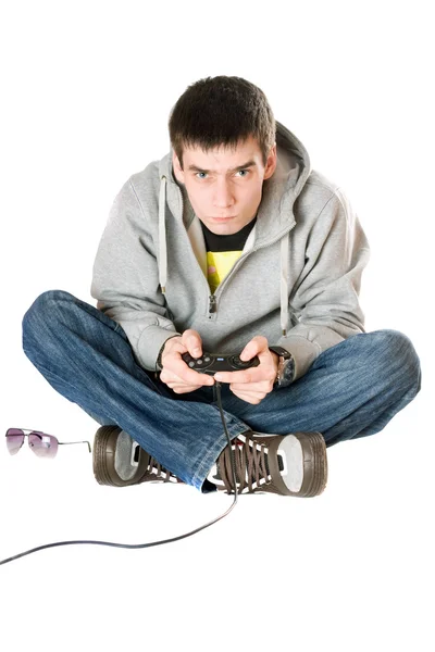 stock image Young man with a joystick for game console. Isolated