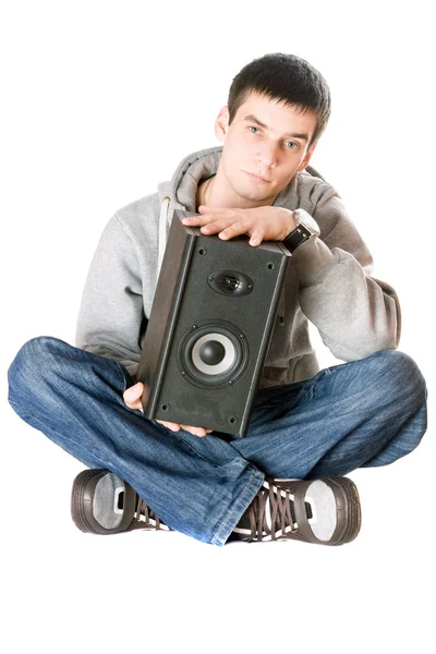 Young man with a speaker in his hands — Stock Photo, Image