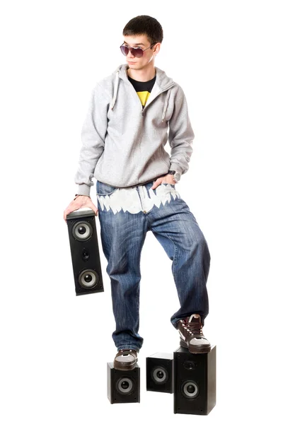 Man in sunglasses standing on the speakers — Stock Photo, Image