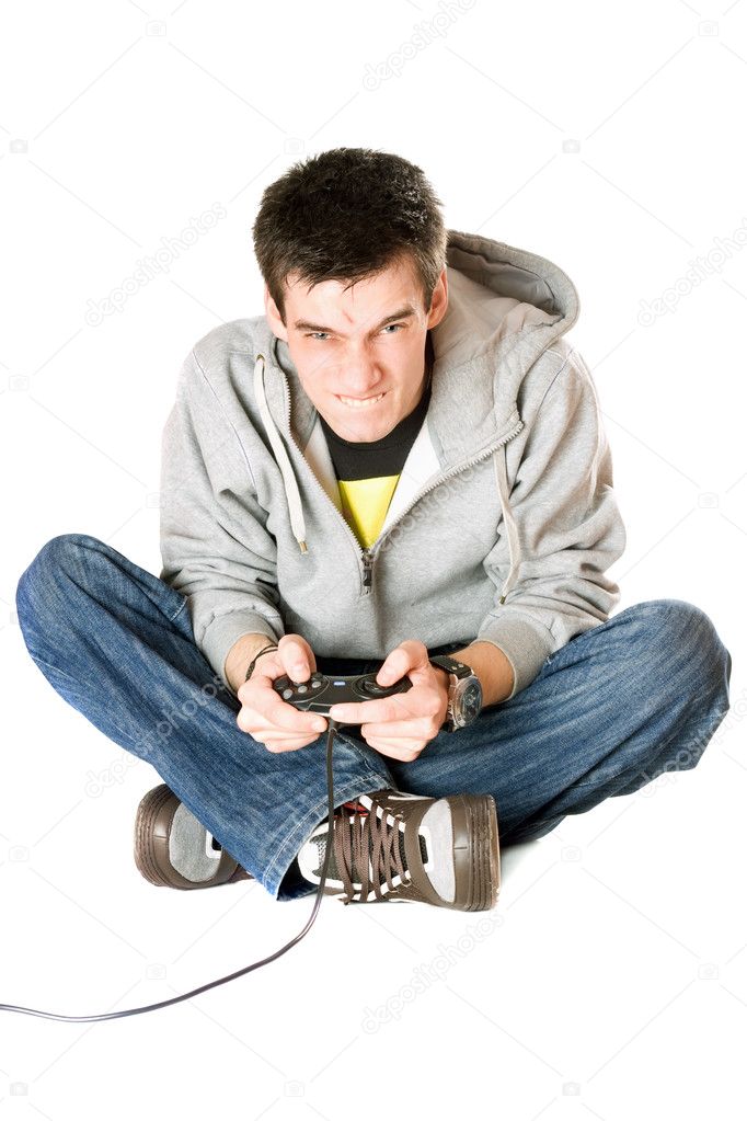 Furious young man with a joystick for game console