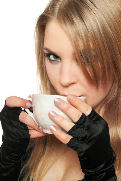 Beautiful young blonde with a cup of tea. Isolated — Stock Photo, Image