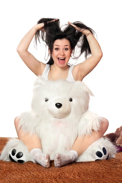 Vrolijk meisje met een teddybeer — Stockfoto