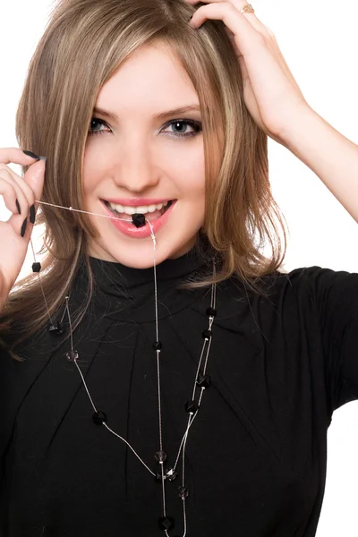 Portret van lachende meisje met een parel in haar mond — Stockfoto