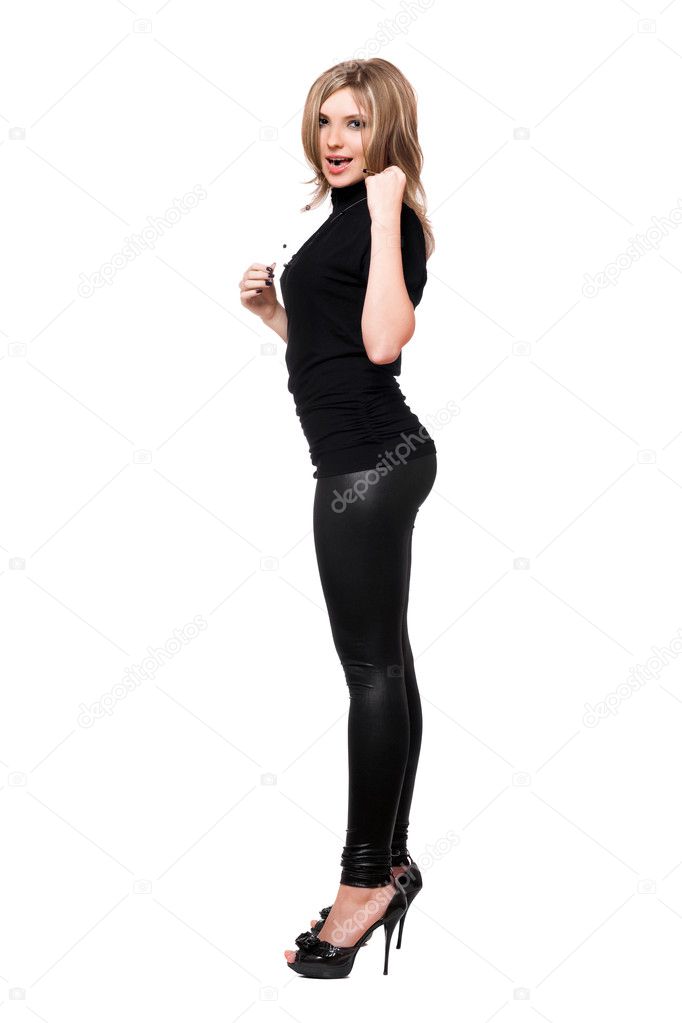 Foto de Sexy girl in silver wetlook leggings posing do Stock
