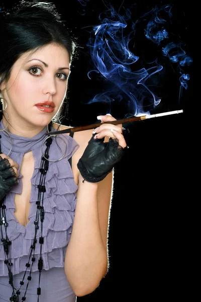 Portrait of a brunette with cigarette holder — Stock Photo, Image