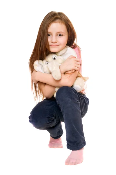 Beautiful little girl with a teddy elephant — Stock Photo, Image