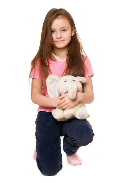 Pretty little girl with a teddy elephant — Stock Photo, Image