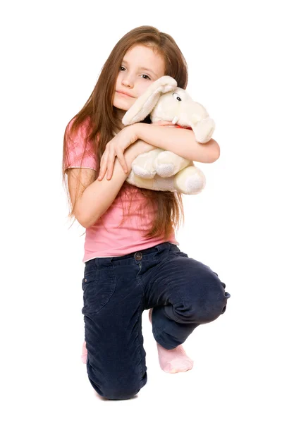 Happy little girl with a teddy elephant — Stock Photo, Image