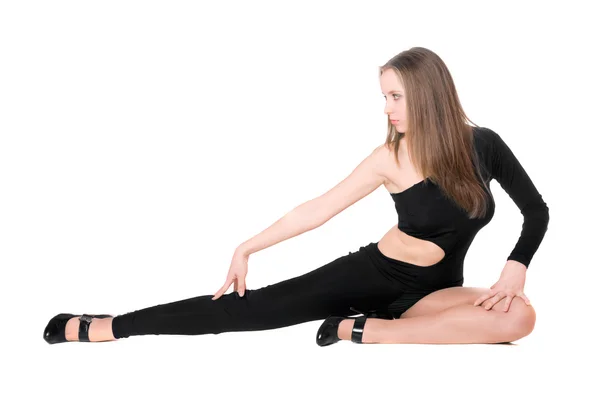 Schöne langbeinige Mädchen in einem schwarzen eng anliegenden Körper Anzug tanzen — Stockfoto