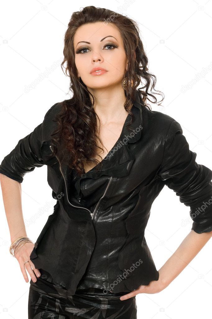 Portrait of perfect young brunette in black clothes. Isolated