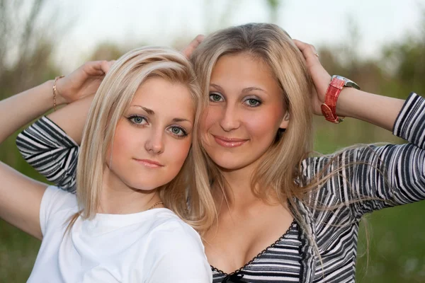 Closeup portrait of two attractive young women — Stock Photo, Image