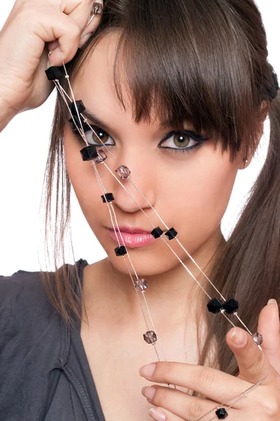 Closeup portrait of pretty brunette with a beads — Stock Photo, Image