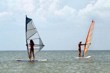 Two girls windsurfers clipart