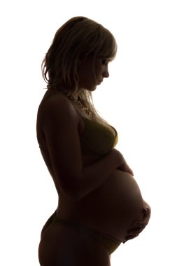 Silhouette of a pregnant young woman. Isolated clipart