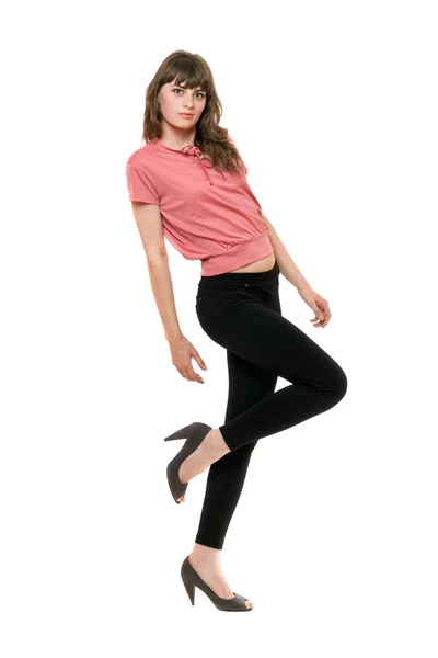 Młoda kobieta zabawy w czarne legginsy. na białym tle — Zdjęcie stockowe