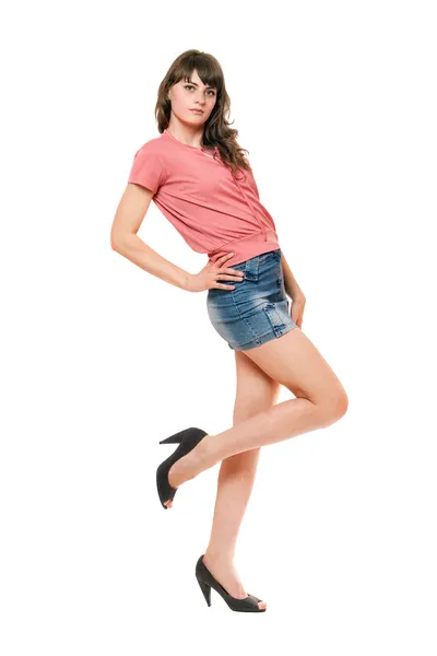 Attraktives Mädchen im Jeans-Minirock. isoliert — Stockfoto
