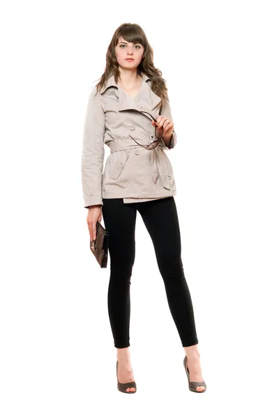 Vacker flicka klädd i en jacka och svarta leggings — Stockfoto