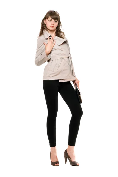 Ładna dziewczyna na sobie płaszcz i czarne legginsy — Zdjęcie stockowe