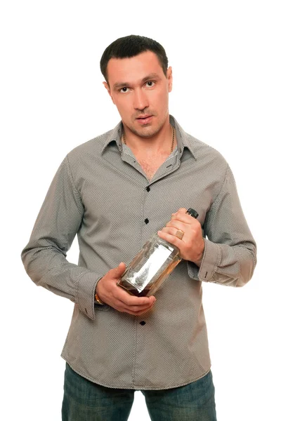 Άνθρωπος με ένα μπουκάλι ουίσκι. απομονωμένη — Φωτογραφία Αρχείου