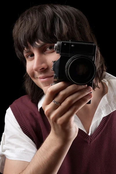 Χαμογελώντας φωτογράφος με το εκλεκτής ποιότητας φωτογραφική μηχανή — Φωτογραφία Αρχείου