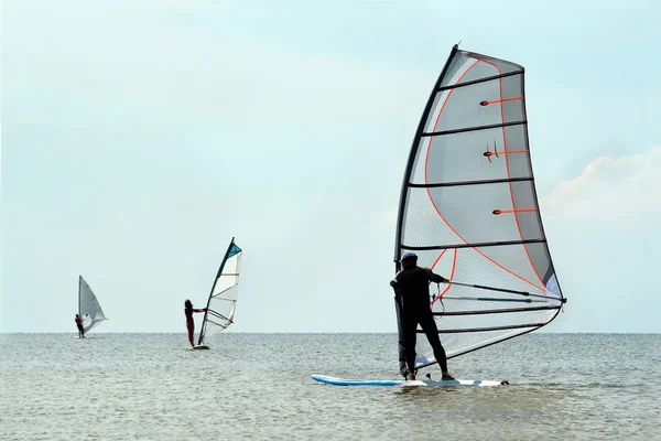 Siluetas de tres windsurfistas —  Fotos de Stock