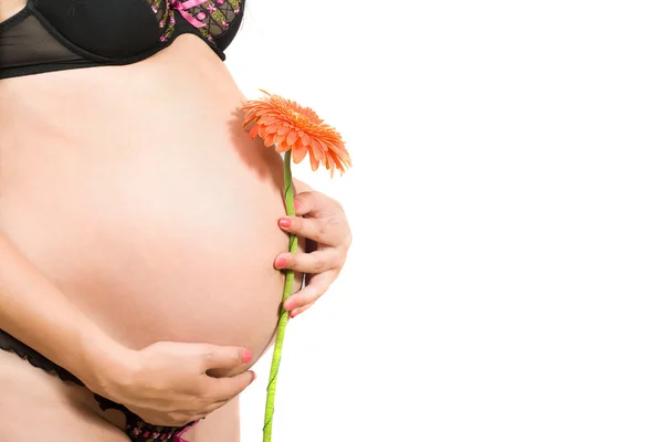 一名年轻孕妇的肚子上 — 图库照片