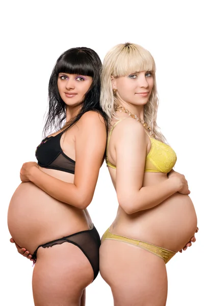 Pregnant blonde and brunette. Isolated on white — Stock Photo, Image