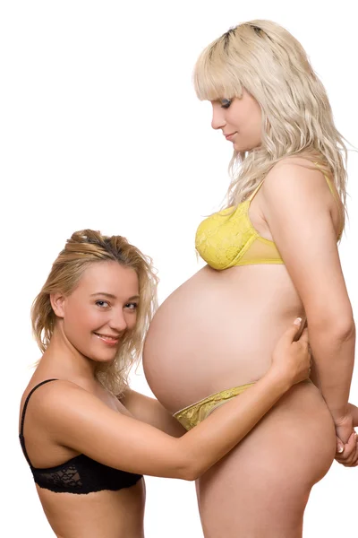 Молодая женщина и беременная девушка — стоковое фото