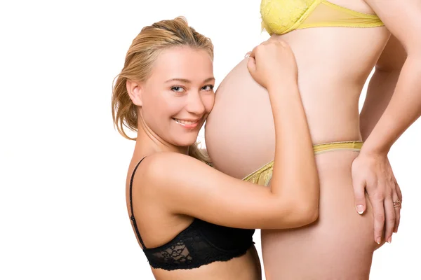 Menina e barriga de namorada grávida — Fotografia de Stock