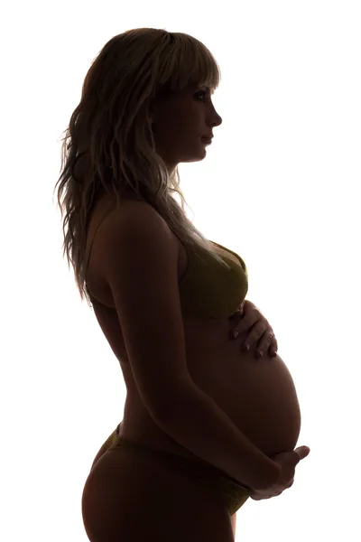 Silhouette d'une jeune femme enceinte — Photo