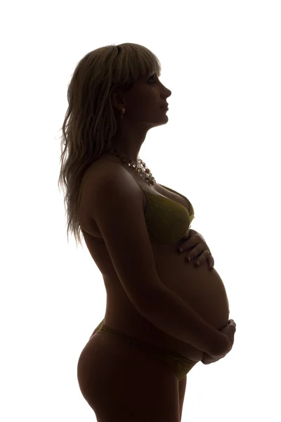 Sylwetka dziewczyny w ciąży. na białym tle — Zdjęcie stockowe