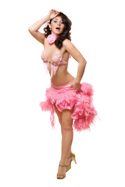 Jonge brunette in roze jurk dansen. geïsoleerd — Stockfoto
