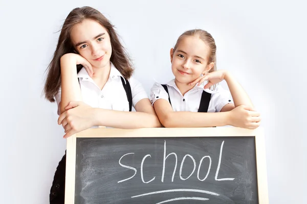 Kız öğrenciler hakkında bir schoolboard — Stok fotoğraf