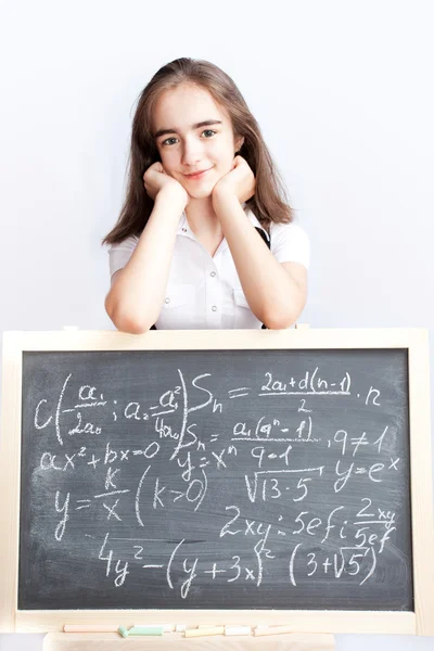 Iskoláslány egy iskolaszék a — Stock Fotó