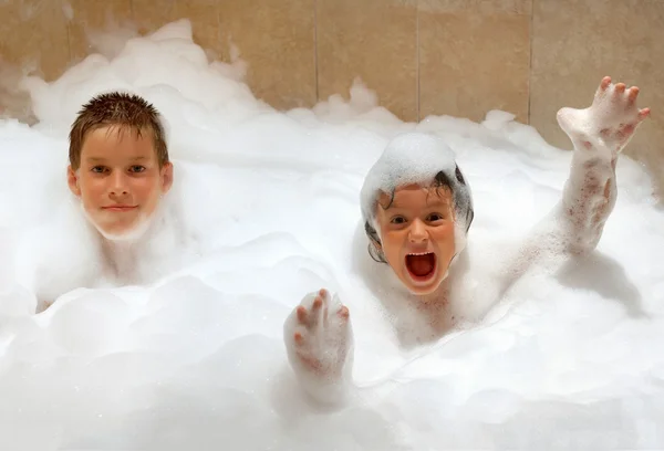 Sister and brother in foam — Stock Photo, Image