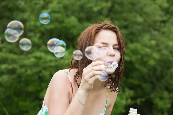 Girl making soap bubbles — Stock Photo, Image