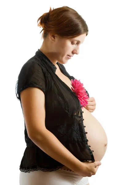 Mulher grávida segurando flor — Fotografia de Stock