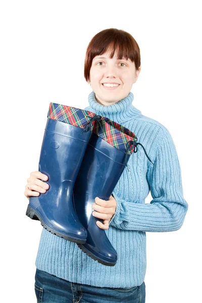 Woman holding waterproof gumboots — Stock Photo, Image